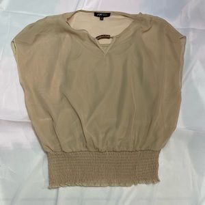Woman’s beige blouse